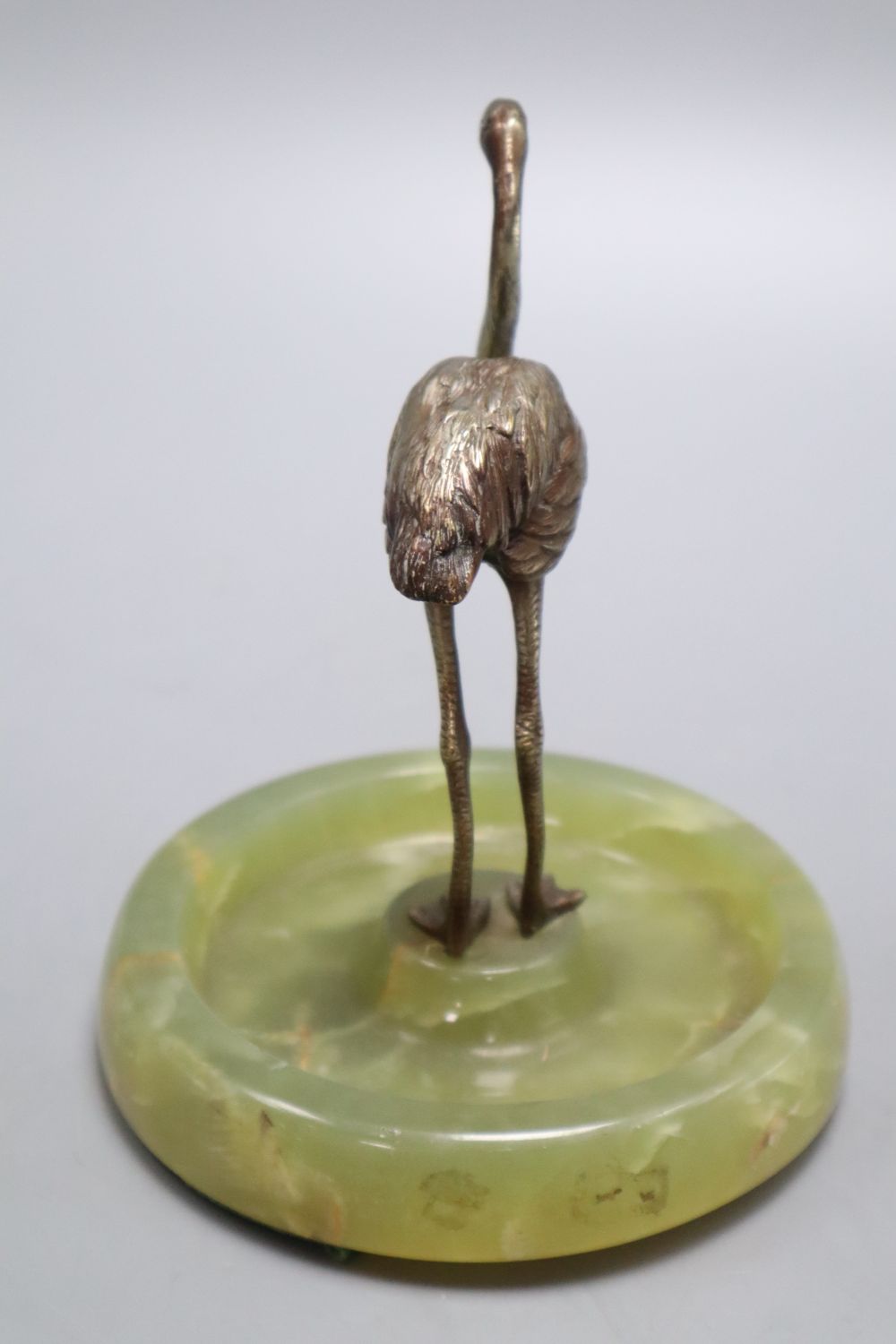A 1920s bronze flamingo, on onyx base, height 15cm